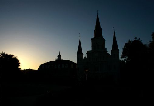 Sun setting behind the St Louis Cathedral in New Orleans