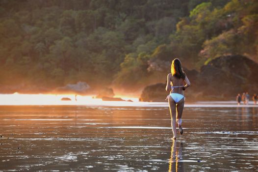 Young beautiful on a beach. One. Coast Pacific of ocean in Costa Rica.