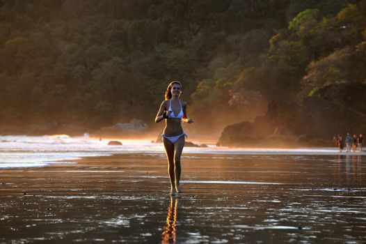 Young beautiful on a beach. One. Coast Pacific of ocean in Costa Rica.