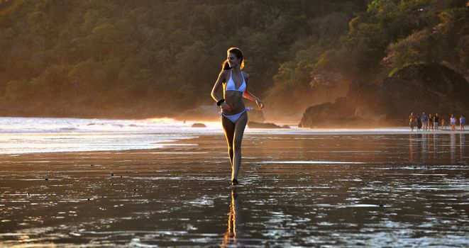 Young beautiful on a beach. One. Coast Pacific of ocean in Costa Rica.