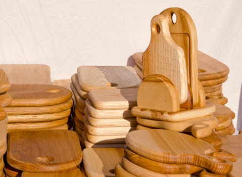 Wooden kitchen cutting boards. Various forms handmade articles made of wood.