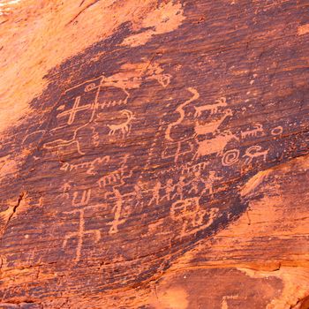 Strange petroglyphs on a rock wall at Valley of Fire State Park in Nevada.