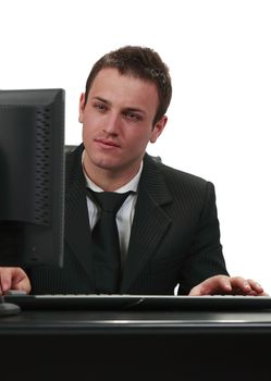 Image of a young businessman working on his computer.