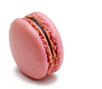 Image of a traditional French pink macaron against a white background.