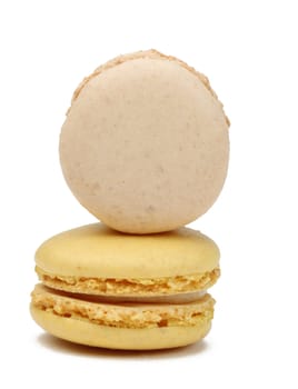Two French macarons isolated against a white background.Useful copyspace for your text on the vertical macaron.