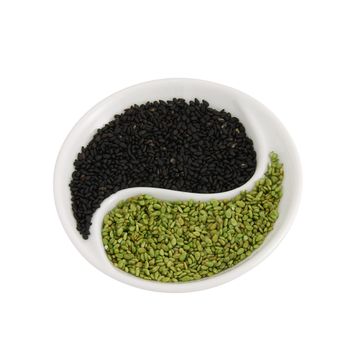 Eastern cuisine - flavored sesame seeds in small yin yang shape plate