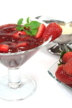 Red fruit jelly with strawberries and lemon balm