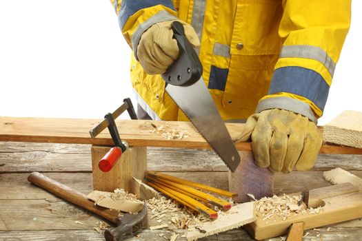 carpenter's hands - working with saw