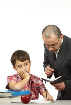 Schoolboy and teacher in classroom 