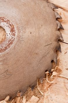 tool series: circular saw on wooden table with sawdust