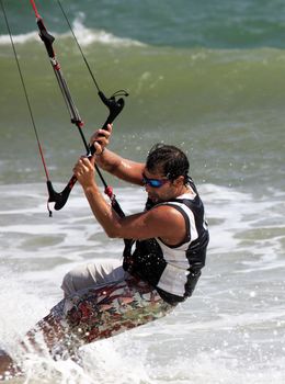 Kiteboarder enjoy surfing in ocean. Vietnam