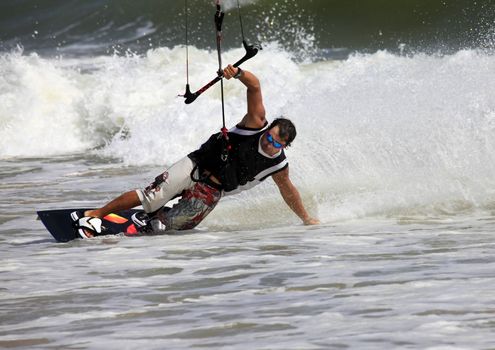 Kiteboarder enjoy surfing in ocean. Vietnam