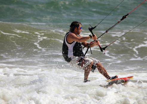 Kiteboarder enjoy surfing in ocean. Vietnam