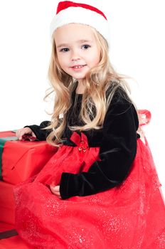 Beautiful baby girl dressed up for Christmas isolated in white