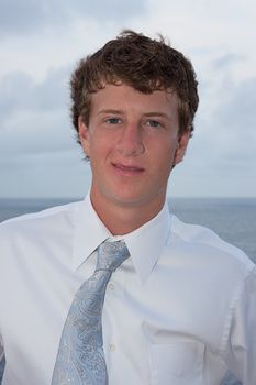 Portrait of a young man with the ocean in the background