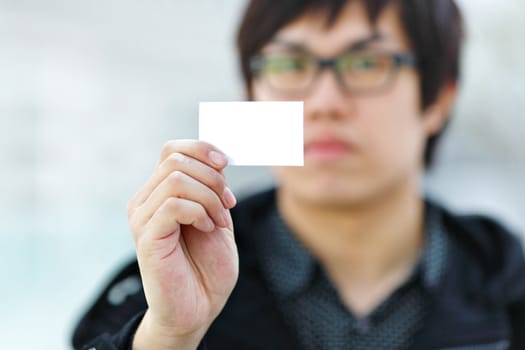 Blank business card in hand