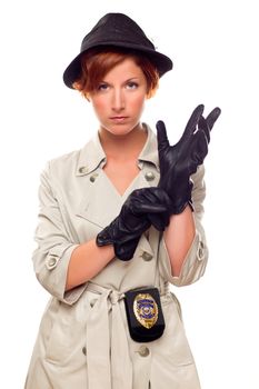 Red Haired Female Detective Putting on Gloves Wearing a Badge, Trenchcoat and Hat Isolated on a White Background.