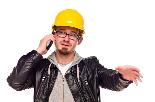 Handsome Young Man in Hard Hat Talking on Cell Phone Isolated on a White Background.