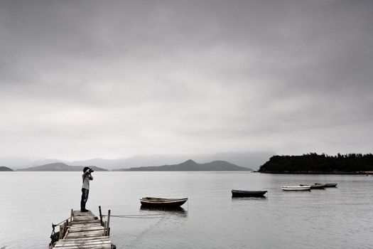 lonely man taking photo