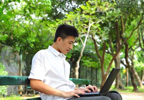 man using computer outdoor