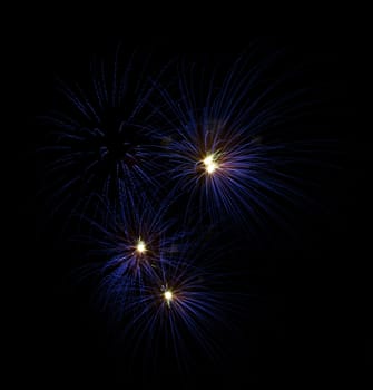 Firework display against black sky