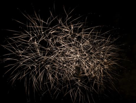 Firework display against black sky
