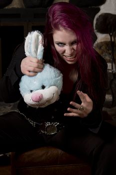 Evil girl with bloody blue plush bunny head