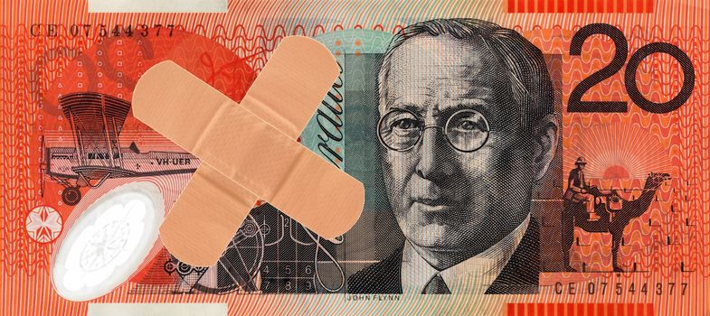 An Australian twenty dollar note and a bandaid