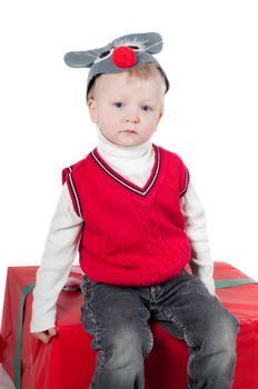 Shot of christmas toddler with presents isolated on white