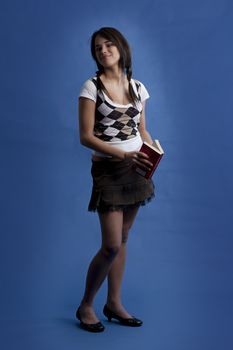 young women taking a look up from reading a book