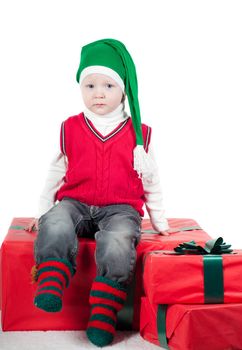Shot of christmas toddler with presents isolated on white