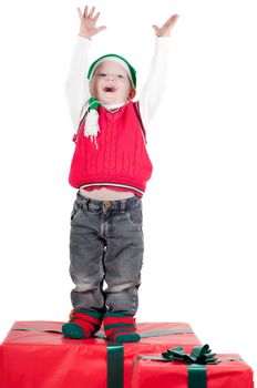 Shot of christmas toddler with presents isolated on white