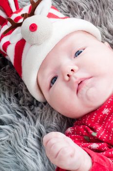 Shot of little cute baby in red