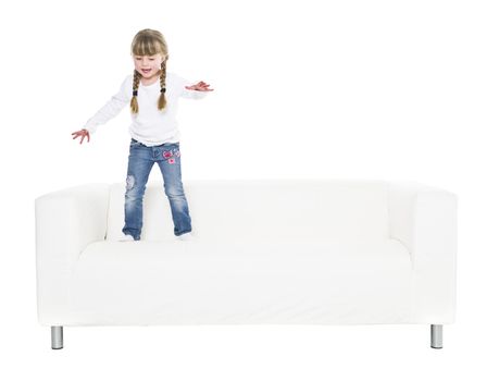 Young girl in a sofa isolated on white background