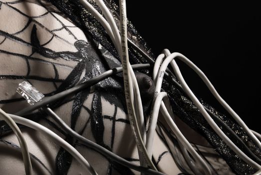 girl with bodyart spider and cobweb being wound 