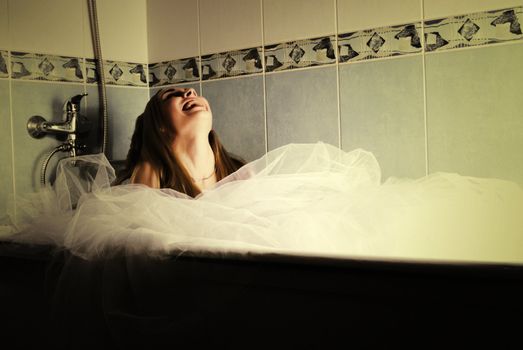 young bride posing in bathroom