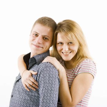 happy young couple. The girl hugs a guy. white background