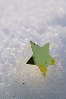 golden snow stars on a real snowy icy surface