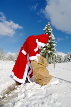 Santa Claus, Father Christmas in a beautiful winter landscape