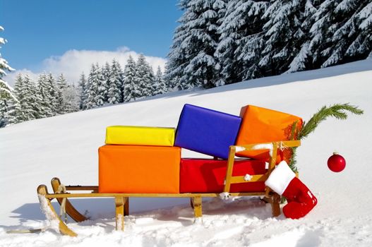 colorful presents on a Santa Claus sledge in a winter landscape