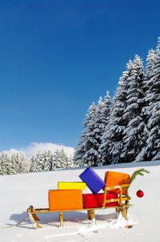 colorful presents on a Santa Claus sledge in a winter landscape