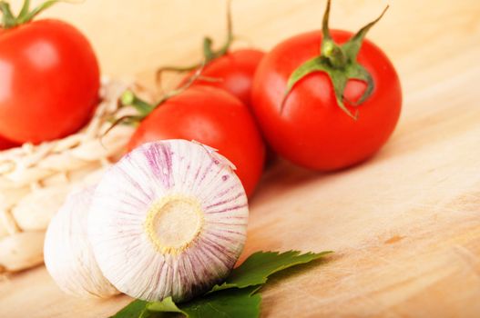 tomatoes and garlic in kitchen showing healthy food concept