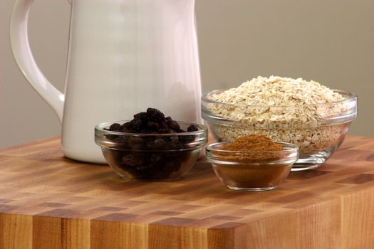 raw and healthy oat flakes with  raisins and other oatmeal ingredients that are  important on your daily nutrition to prevent high colesterol and heart dideases 