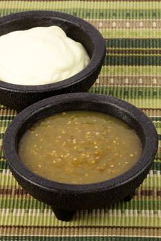delicious sour cream and salsa verde or tomatillo sauce made with hot peppers and fresh tomatillos   
