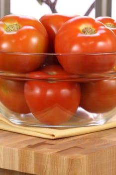 fresh healthy delicious organic  tomatoes  on clear bowl ,organic vegetarian food 