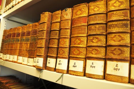 books in a library bookshelf for university education