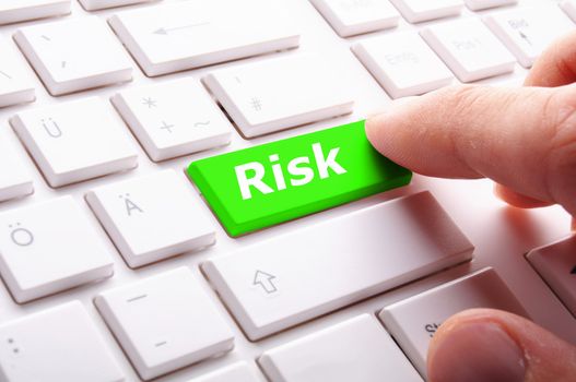 risk management concept with word on key showing risky investment