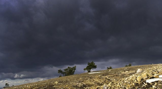 Dark thunderclouds and last sunlight 