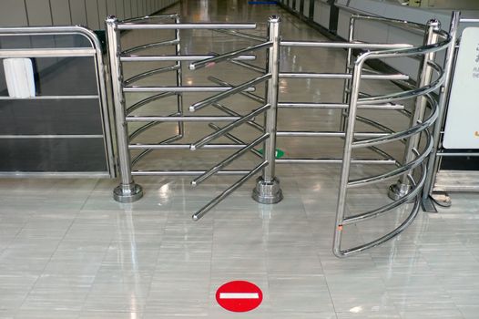 metal fence with gate and stop-sign on the floor