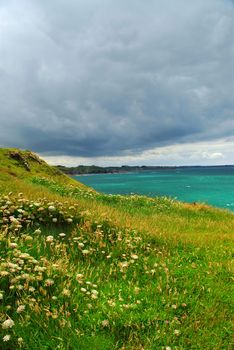 Landscape of rocky Atlantic coast in Brittany France with stormy sky